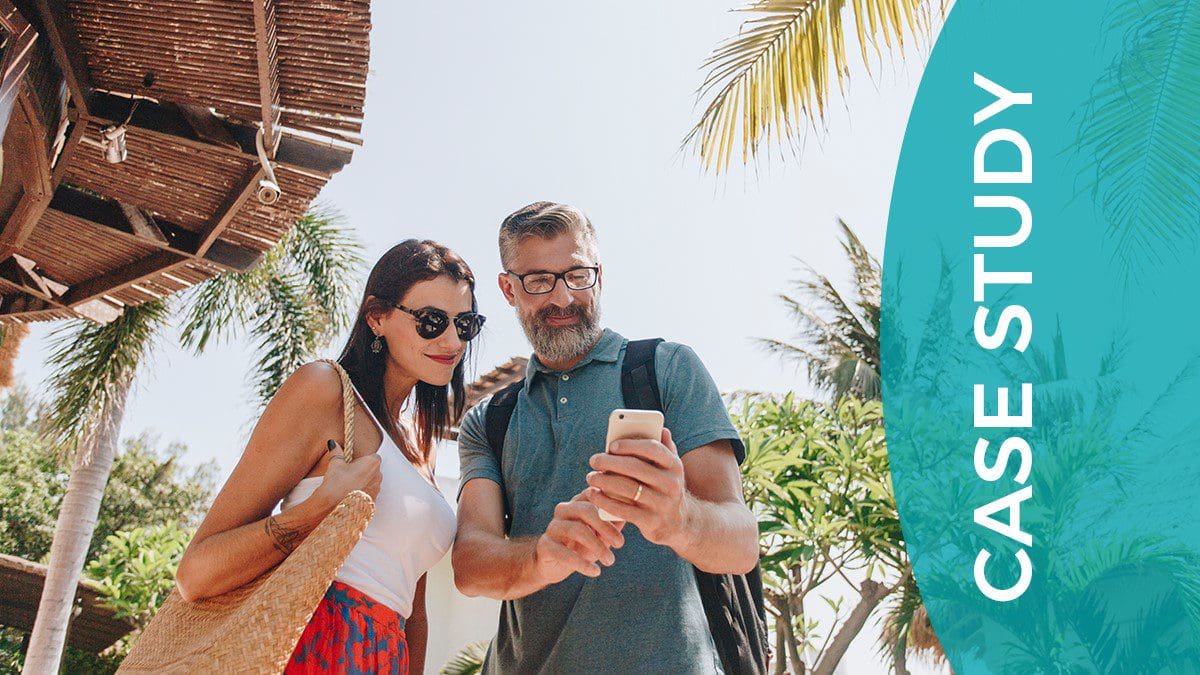 Holidaying couple using a mobile wallet resort pass developd by arrivia to access a complimentary check-in bonus that successfully reduced booking no-shows for the resort operator