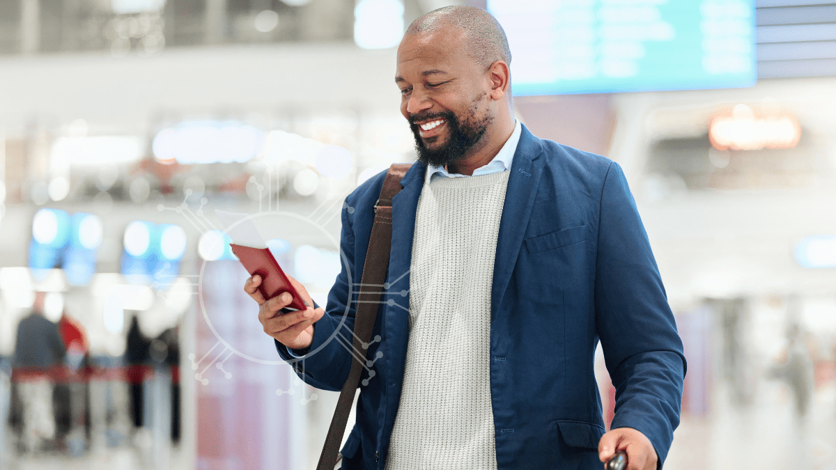 A Man standing in the airport using ai powered personalized recommendations for travel.
